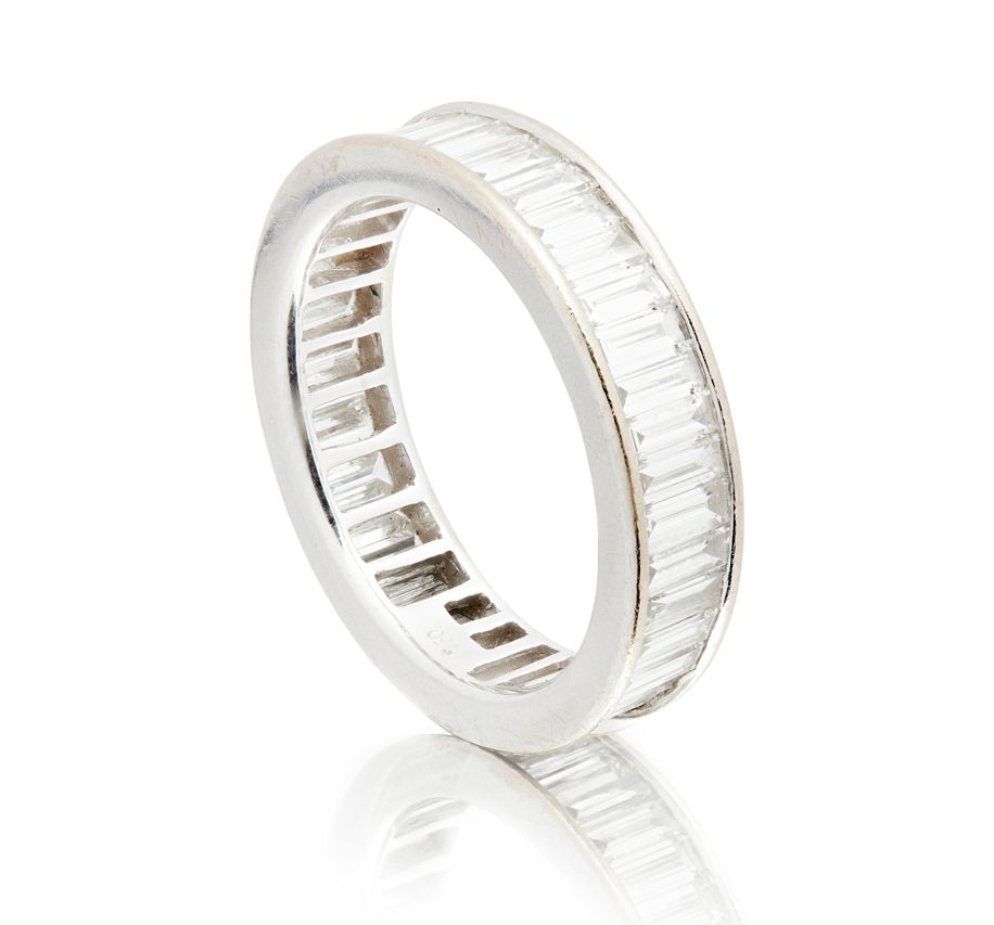 A DIAMOND SET ETERNITY RING  Sold for £2,000