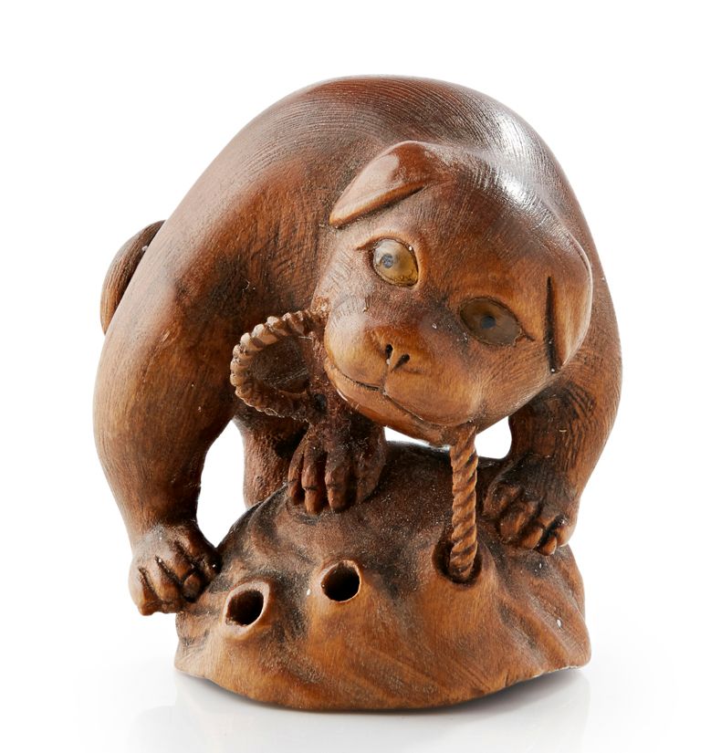 CARVED WOOD NETSUKE OF A PUG SIGNED TOYOMASA, MEIJI PERIOD  Sold for £450
