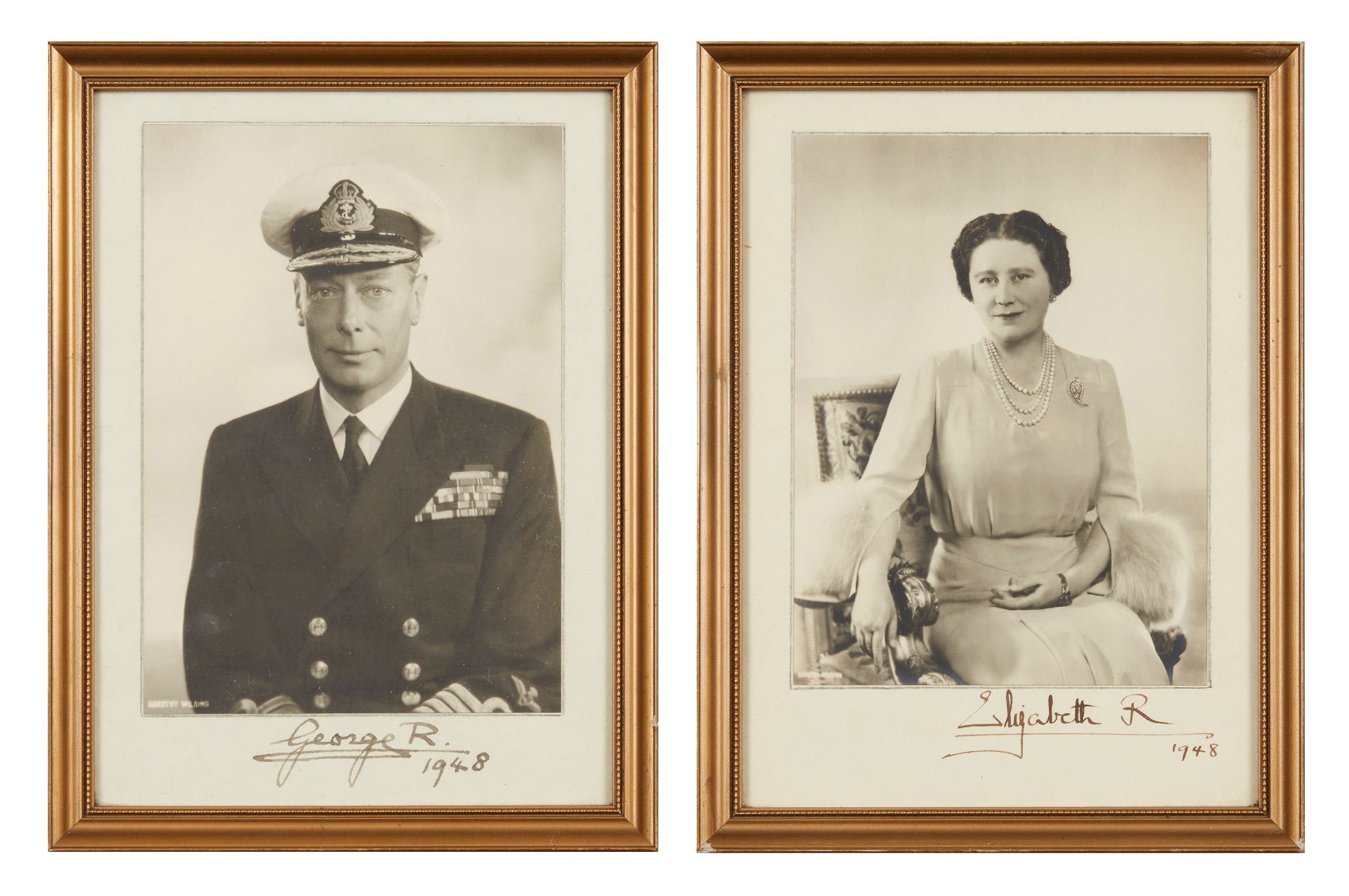 GEORGE VI, KING OF GREAT BRITAIN AND IRELAND (1895-1952) & ELIZABETH (1900-2002), QUEEN CONSORT | A PAIR OF SIGNED PHOTOGRAPHS | Sold for £1,386