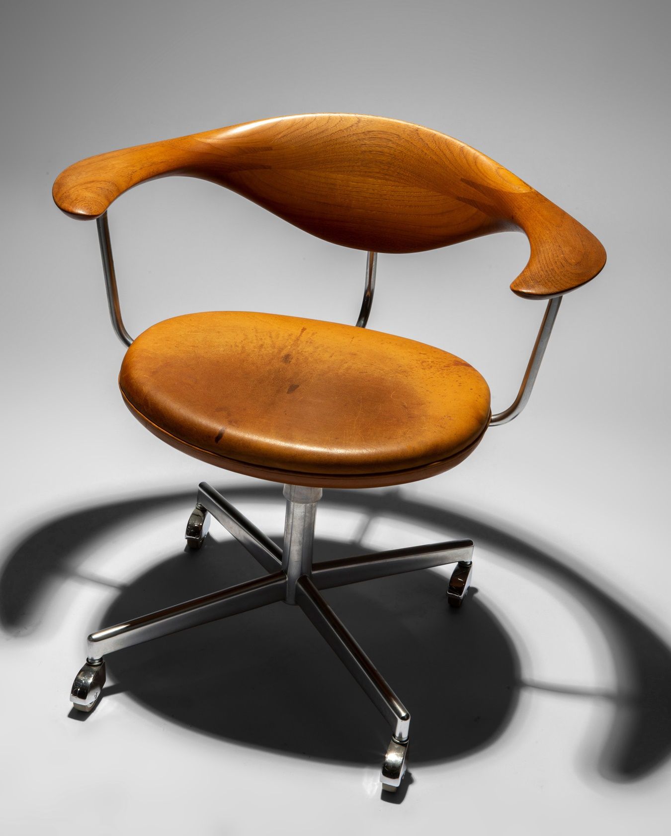 HANS WEGNER (DANISH 1914-2007) | SWIVEL CHAIR | Sold for £15,000*